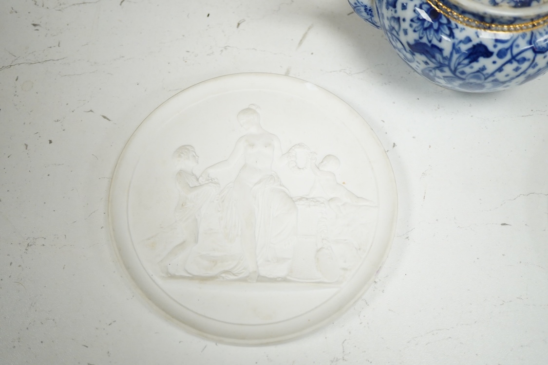 A pair of Copenhagen biscuit relief plaques of Night and Day, after Thorvaldsen, 15cm diameter, plus two pairs of vases, a blue and white plate and teapot (8)